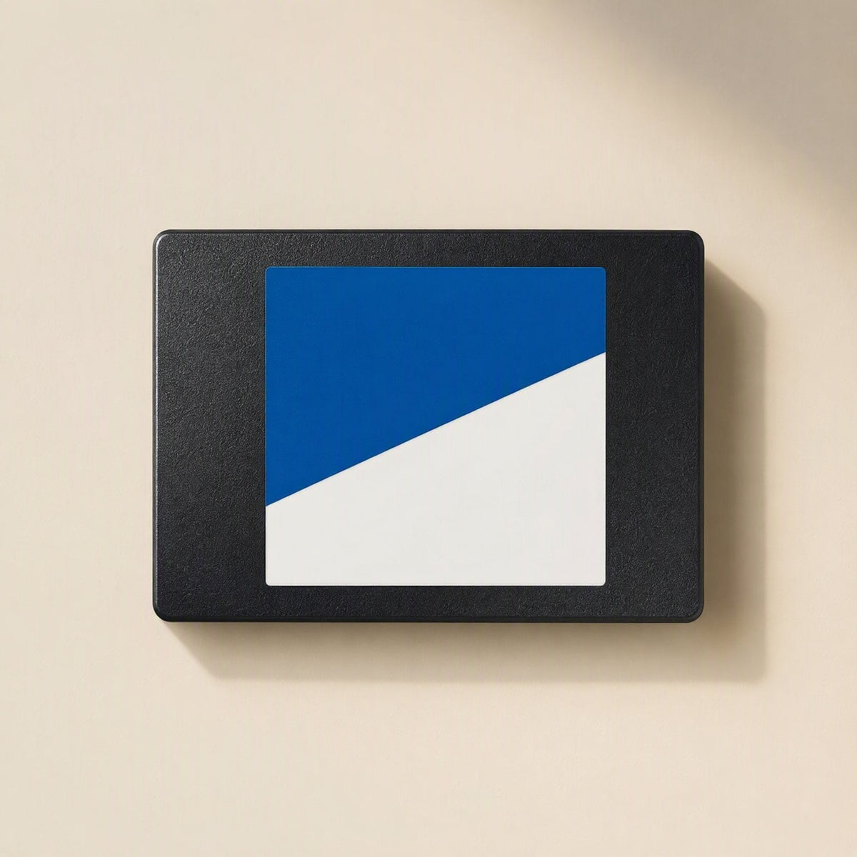 Satadrive 2.5-Inch SATA SSD – blue and white label on the black metal casing, seen from above