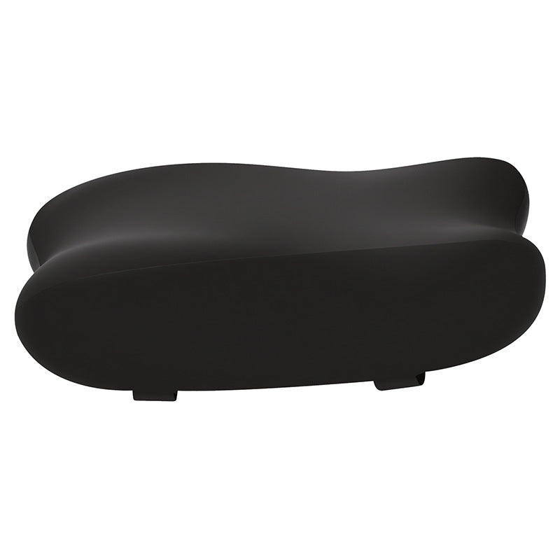 Comfycurve – Single black curved armrest pad shown from the side on a white background with two small tabs underneath