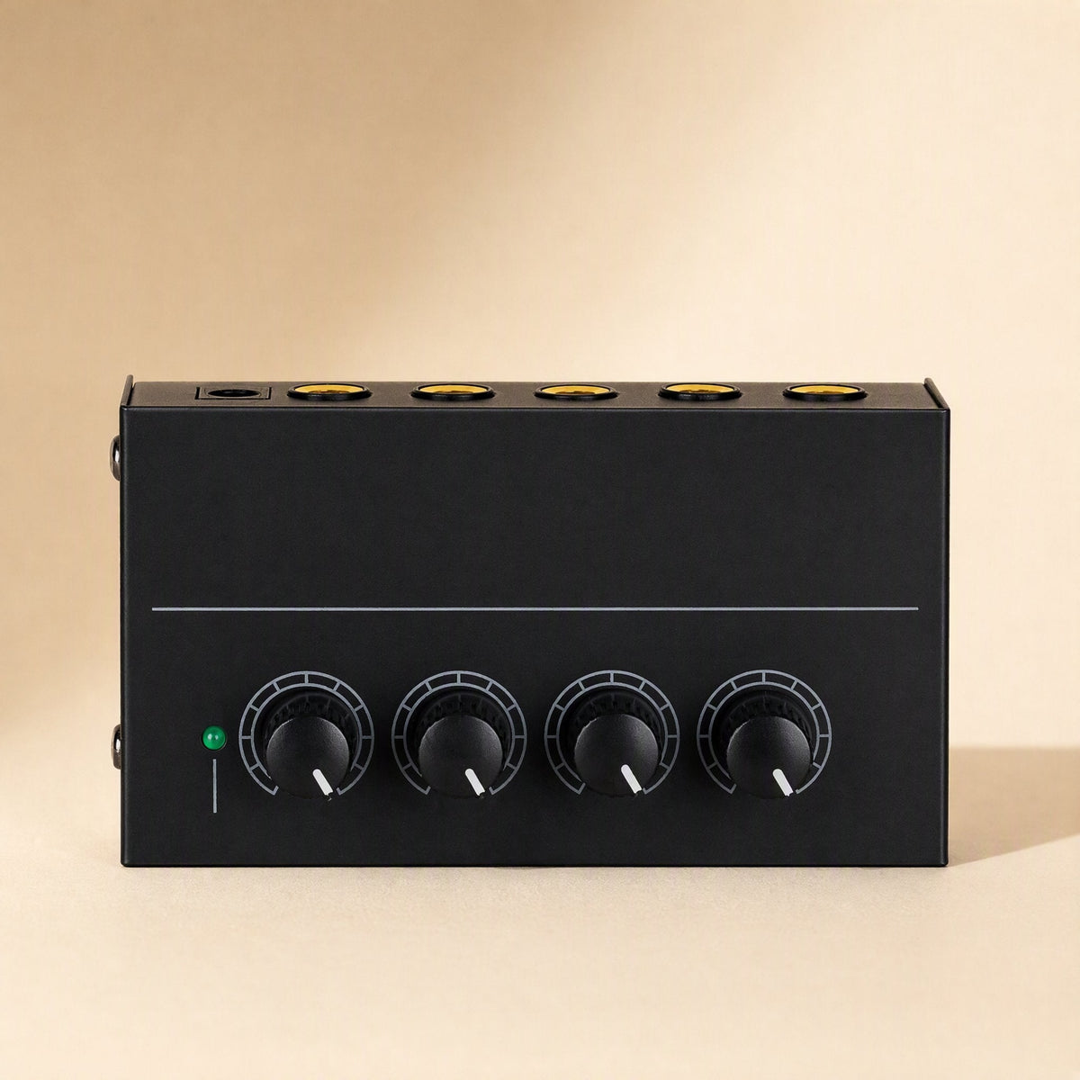 Ampwave Stereo Headphone Amplifier for Gaming, front view with four black volume knobs and green power light