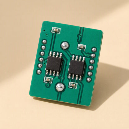 Ampwave – Green circuit board with two small black chips and silver solder points, shown at an angle