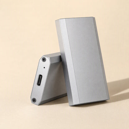 Bytehusk mSATA Solid State Drive Enclosure, silver aluminum, one unit leaning on another to show USB-C port
