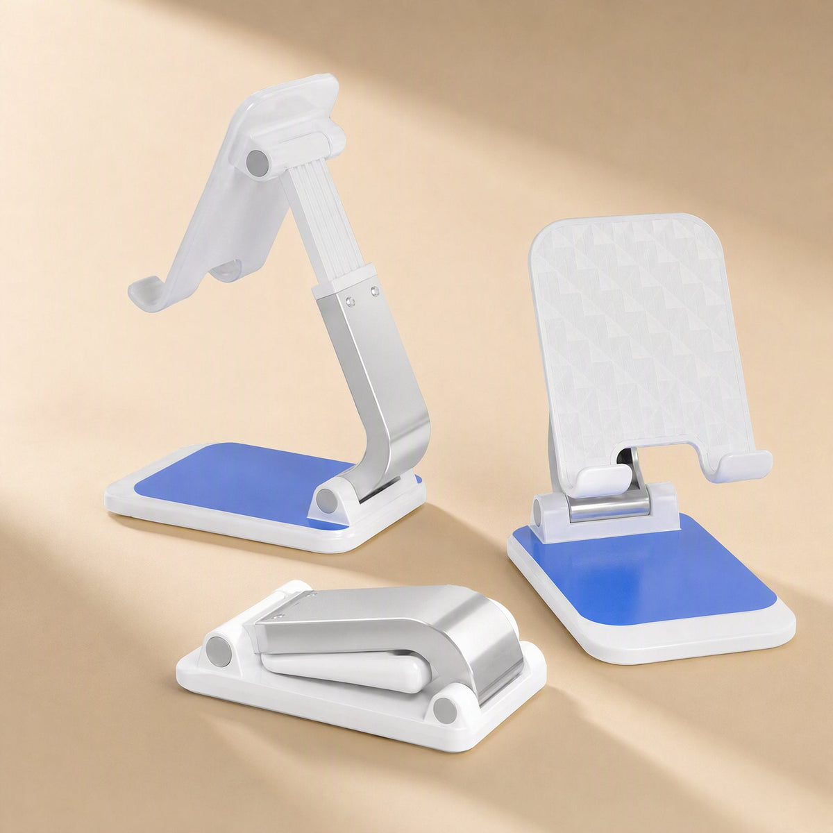 Phonecove Desktop Phone Holder in white and blue, shown upright at two angles and folded flat