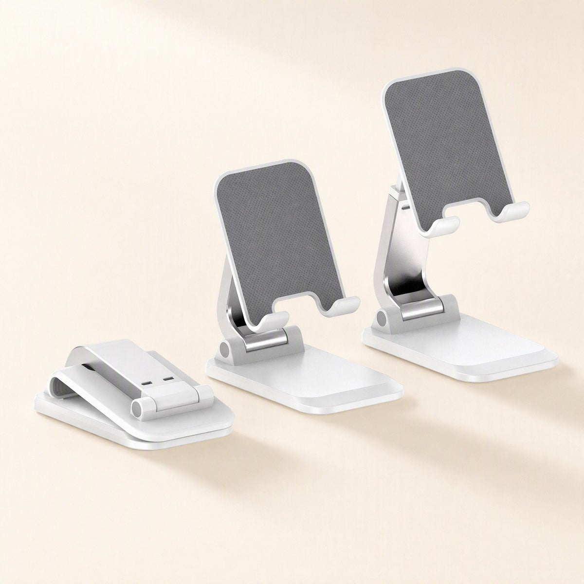Foldcradle ABS Foldable Phone Stand – row of three white stands: one folded flat, one at a low angle, one at a taller angle