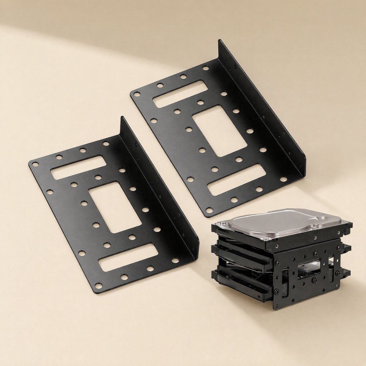 Bayrise Desktop Hard Disk Expansion Bracket pair in black beside a stack of 3.5 inch drives