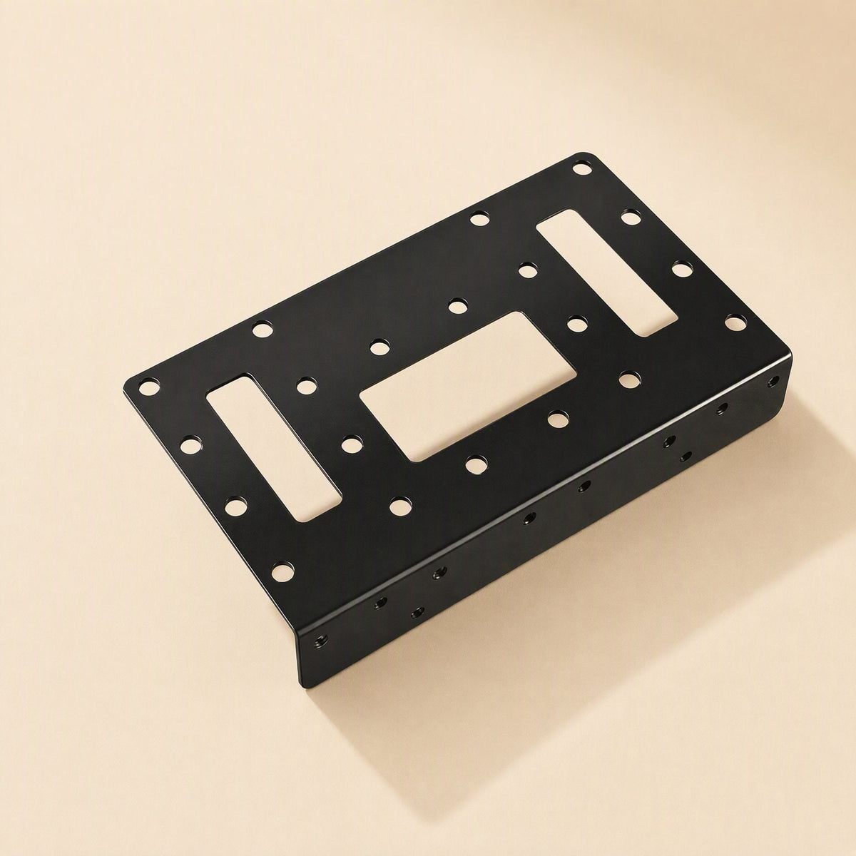 Bayrise – Single black metal bracket with slotted cutouts and screw holes, top-down angled view