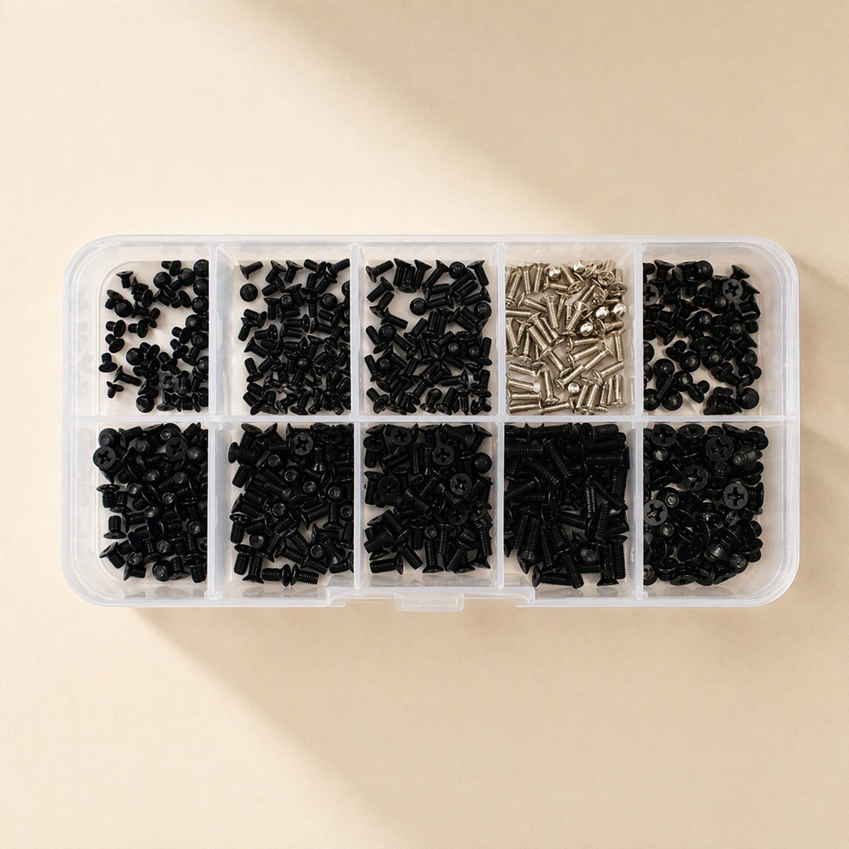 Sinkfast – Top view of the clear screw box with ten compartments of black screws and one of silver screws