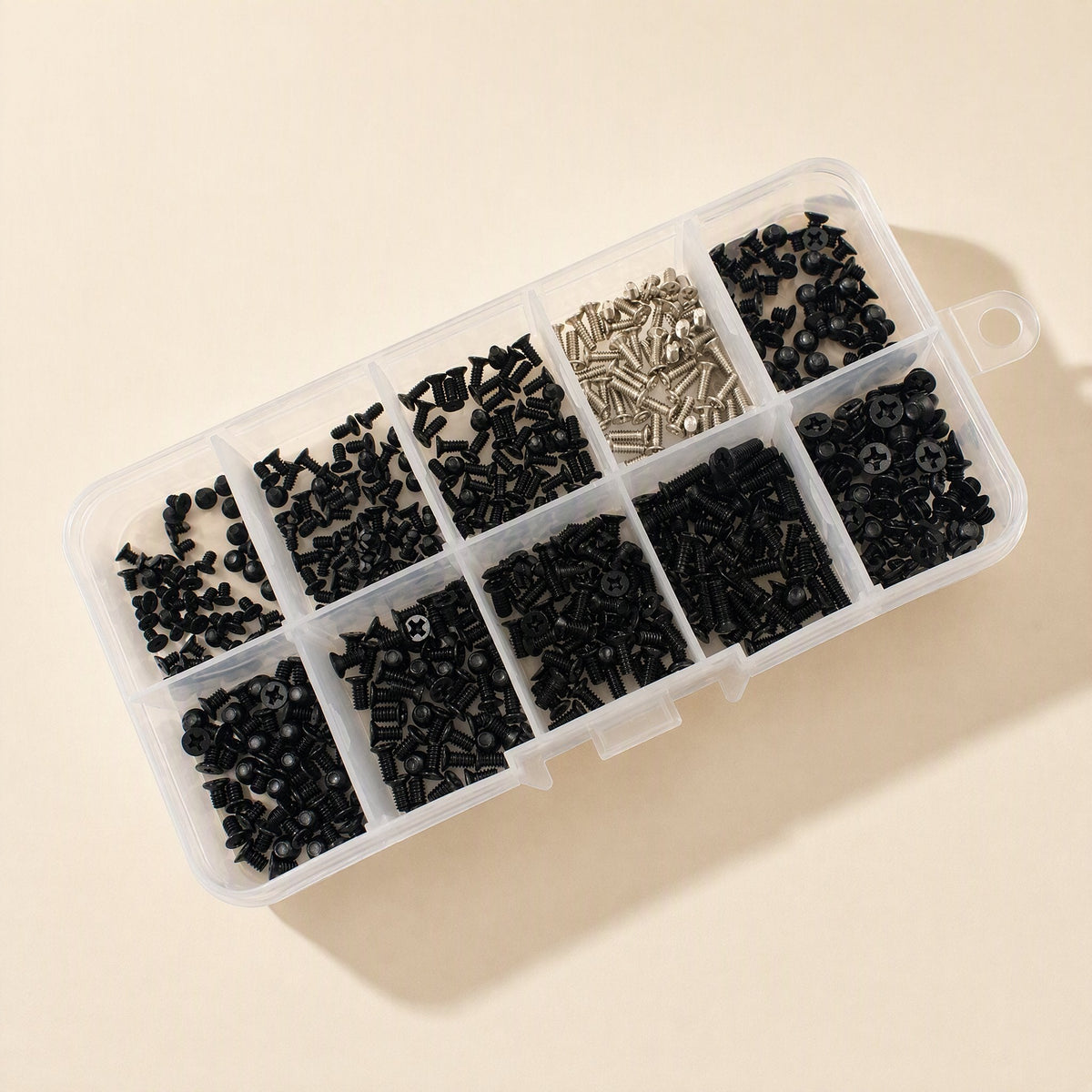 Sinkfast – Angled view of the open organizer box showing black and silver laptop screws in separate sections