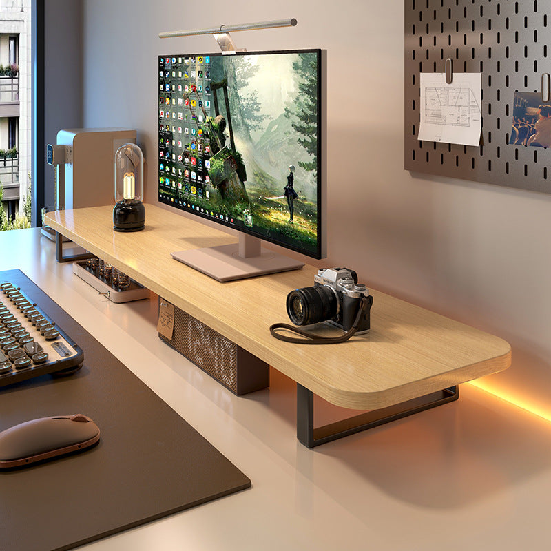 Deskloft – Light oak single-tier monitor stand with black legs above a keyboard, mouse pad and desk lamp