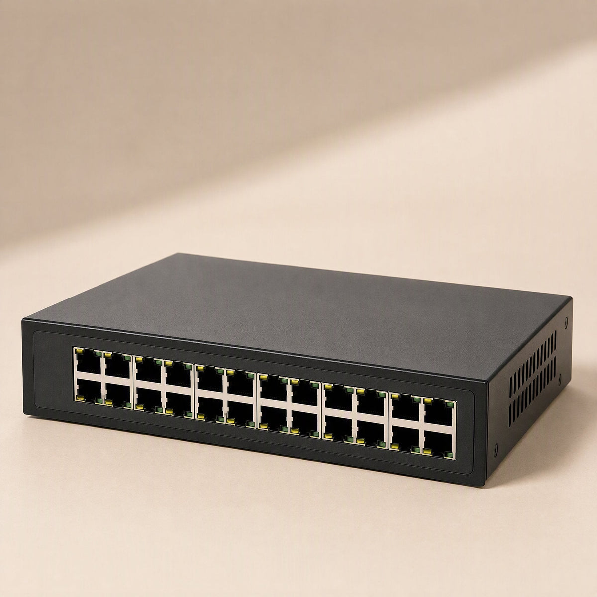 Netfork – Front-angled view of a 24-port black switch showing port LEDs and side ventilation slots