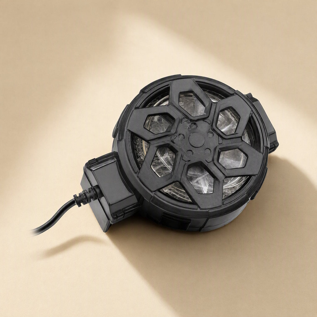 Frostclip – Back view of the clip with the fan unlit, showing the dark hexagonal grille and black cable