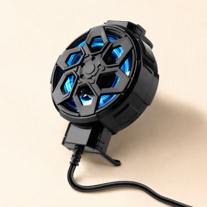 Frostclip – Angled view of the clip with blue fan lit, cable curving across a cream surface, bottom clamp as a stand