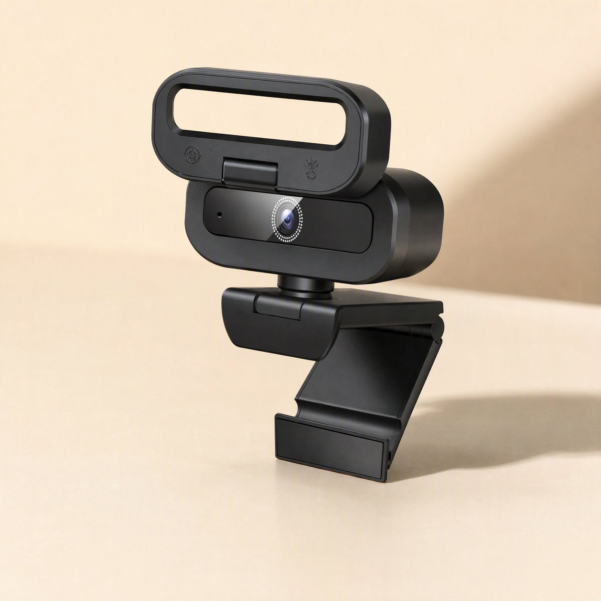 Focussnap USB Computer Camera – black webcam with open ring light frame, seen from the front left on a cream backdrop