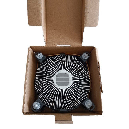 Hushvane – Top view of the radial-finned aluminum cooler with four mounting pegs, resting in an open cardboard box