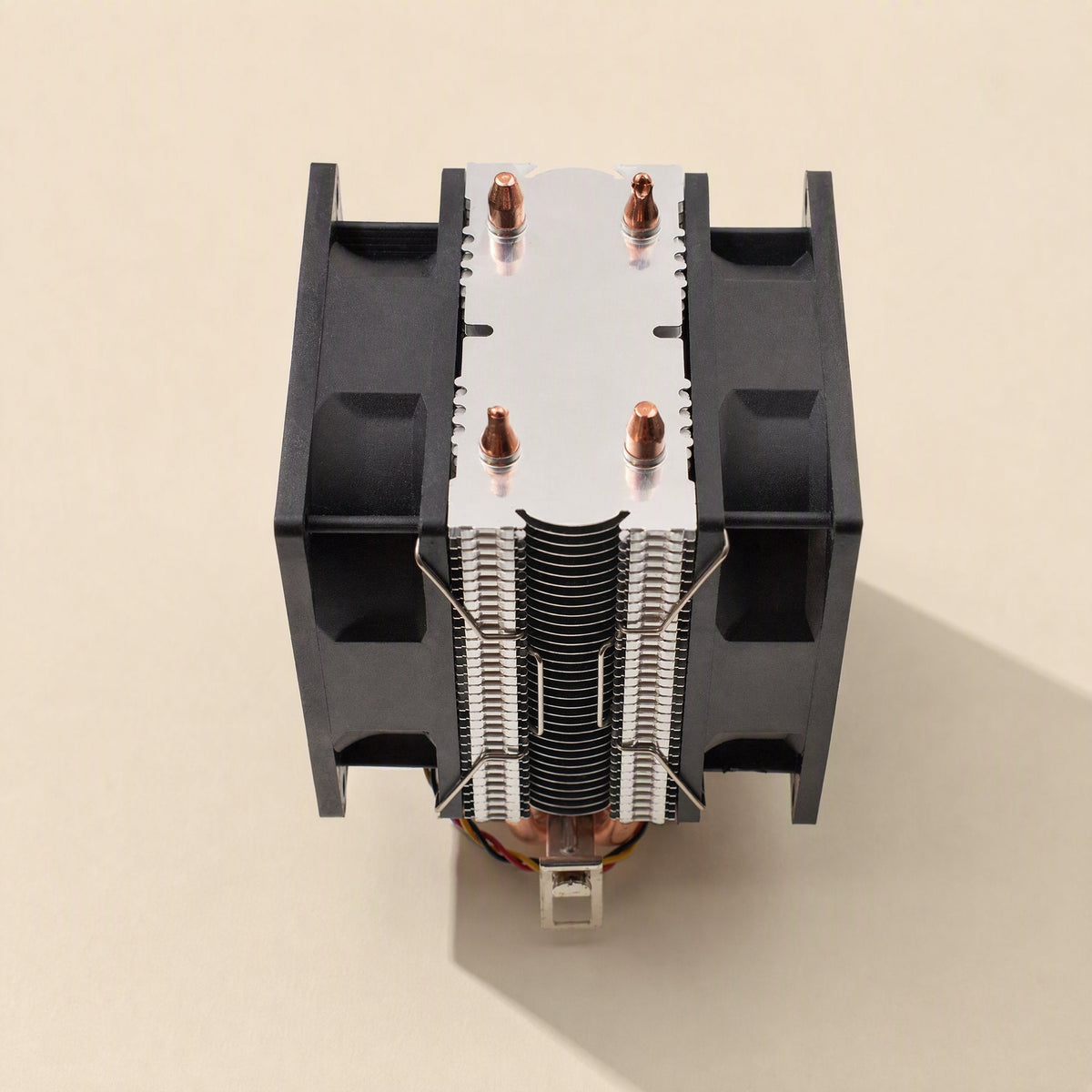 Fanlatch – Top-down view of a twin-fan CPU cooler with wire clips securing both fans to the aluminum fins