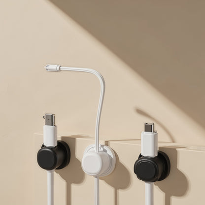 Spinsteady – Three wall-mounted organizers in black and white holding USB-C and Lightning cables at different angles