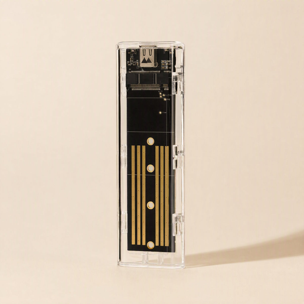 Diskhull – Top-down view of the transparent enclosure showing the black circuit board with gold contact stripes