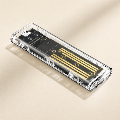 Diskhull – Angled view of the see-through case with the gold-striped board and USB-C port at the far end