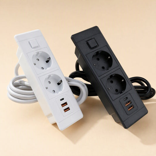 Plugnest – Two-socket desktop sockets in white and black, standing upright with coiled power cords and USB-C and USB-A ports