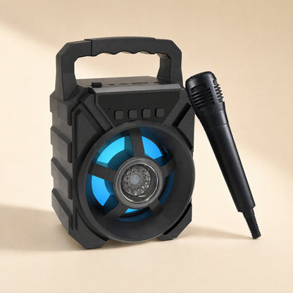 Roamsound – Black speaker with blue light ring angled to the side, wired microphone leaning against it