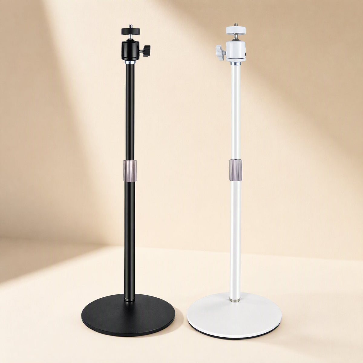 Toneanchor Desktop Microphone Stand in black and white side by side on a beige backdrop