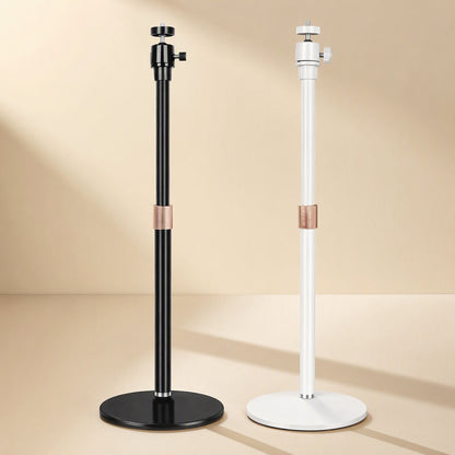Toneanchor – Black and white stands with copper-toned locking collars on the pole, set against a warm studio background