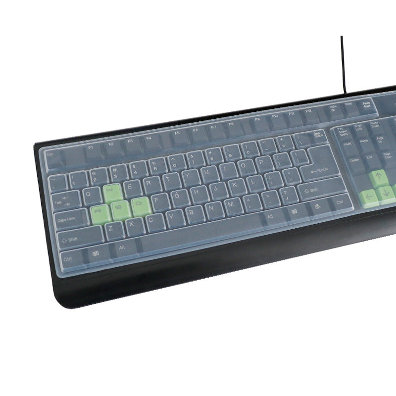 Dustshell – Clear silicone cover on a black wired keyboard with green highlighted keys, shown at an angle
