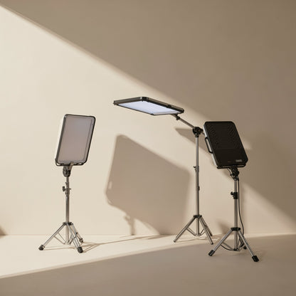 Facegleam – Three LED panels on tripod stands of different heights, one tilted flat overhead and one showing its black back