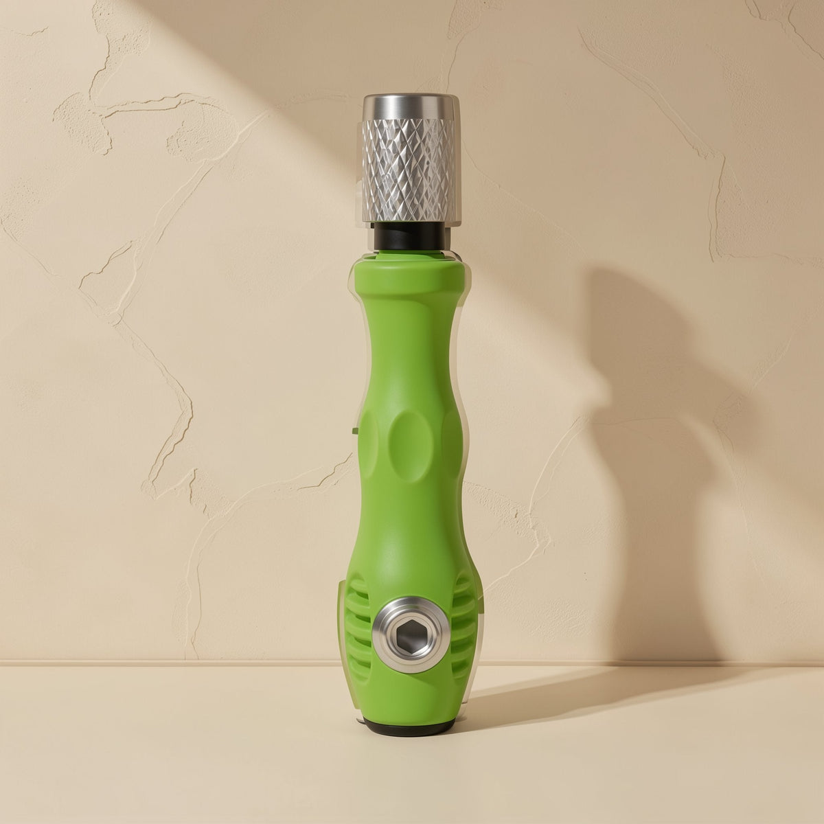 Pocketbit 32-in-1 screwdriver set: green handle standing upright with knurled silver cap on a beige backdrop