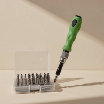 Pocketbit – Green screwdriver with a bit attached, angled beside an open clear case of neatly arranged bits