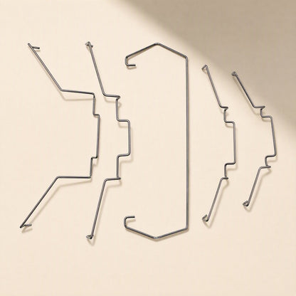 Fanclip Steel Wire CPU Radiator Fan Buckle, five metal clips laid out flat on a cream background