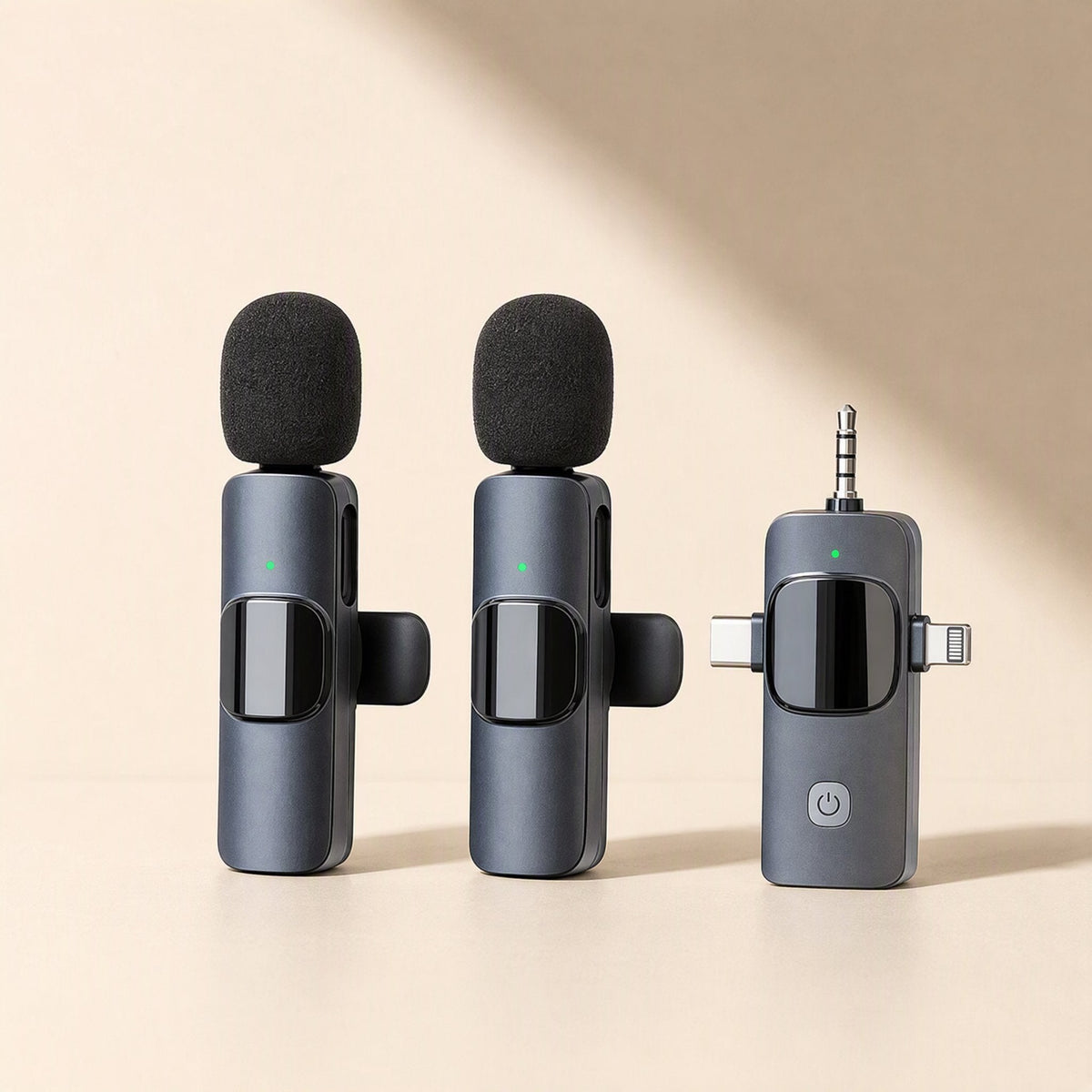 Voiceclip Wireless Lavalier Mic: two clip-on mics with foam windscreens beside a multi-port receiver, slate blue