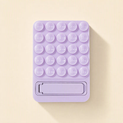 Suctionstay – Lavender suction cup phone holder from the front with a folded kickstand at the bottom