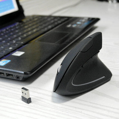 Upright Vertical Optical Mouse – black vertical mouse on a white desk next to a laptop and a small USB receiver