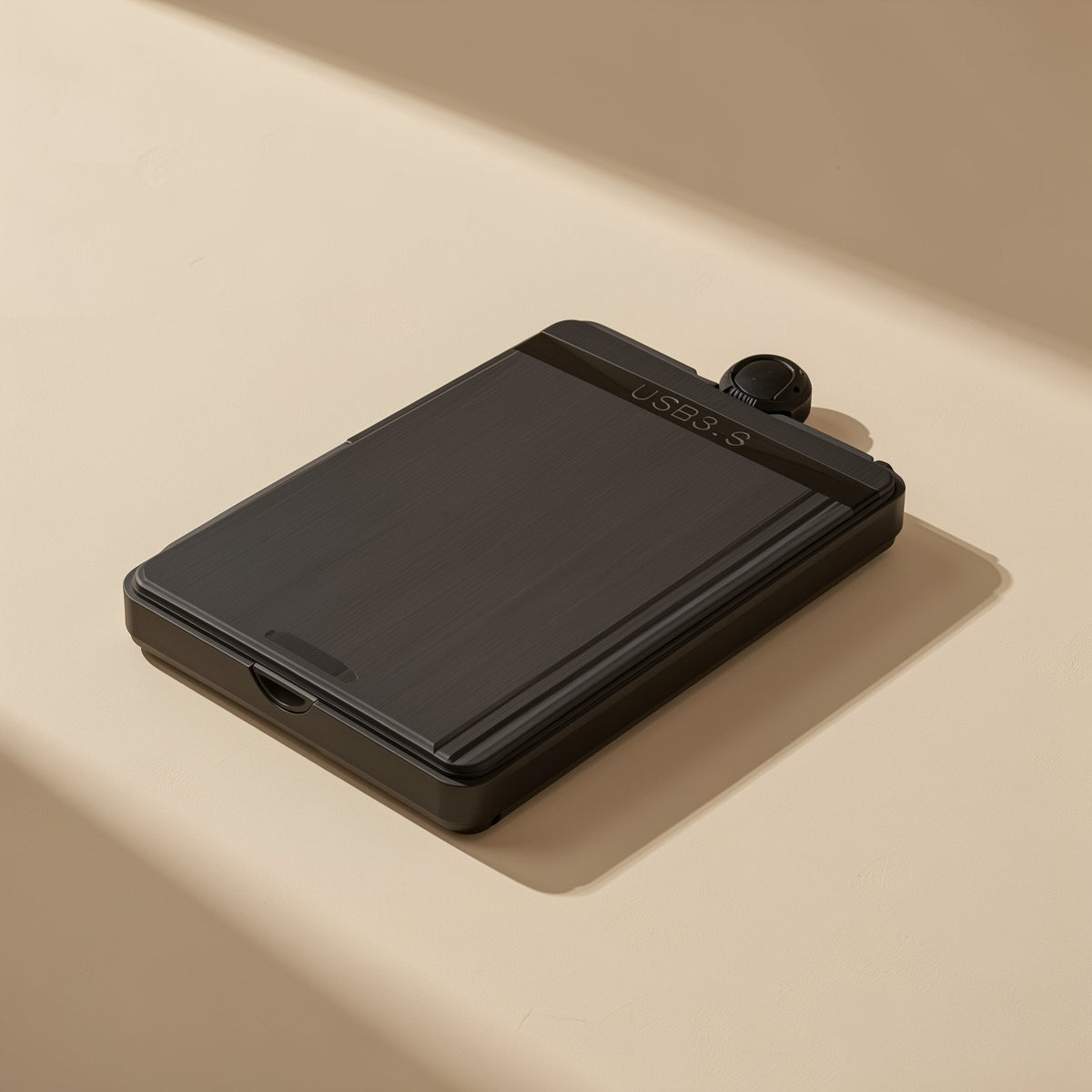 Datahush 2.5-inch USB 3.0 hard drive enclosure in black, shown at an angle on a cream surface