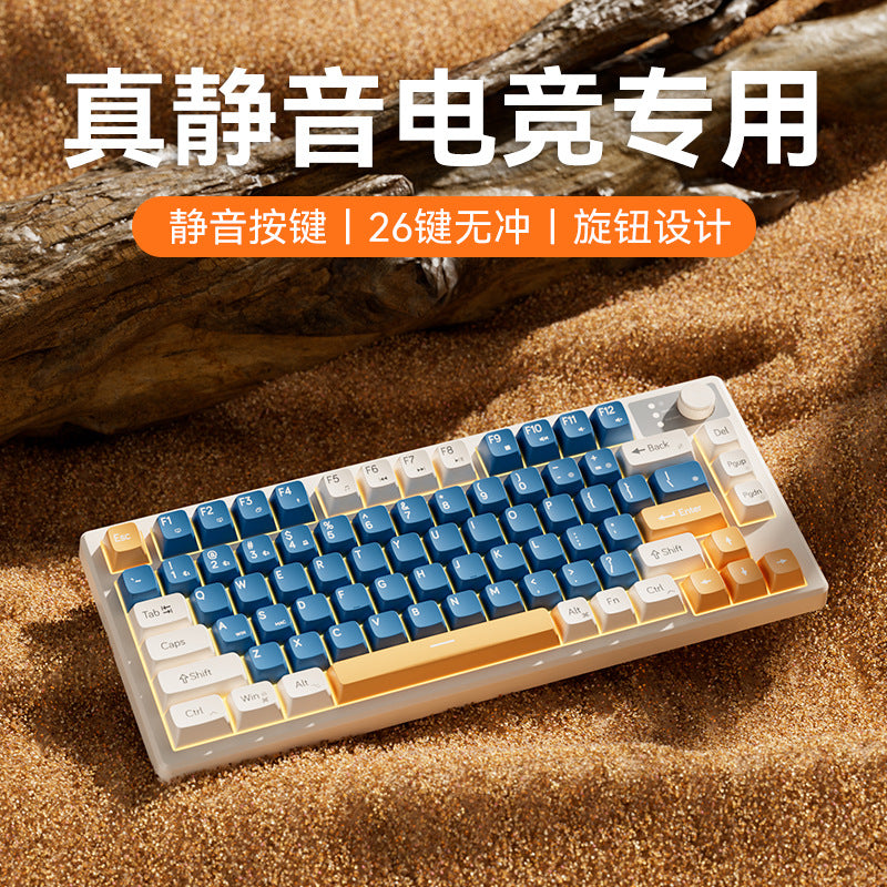 Keystrike Gaming Keyboard And Mouse Set: blue, white and orange keyboard on sand beside driftwood, with a knob
