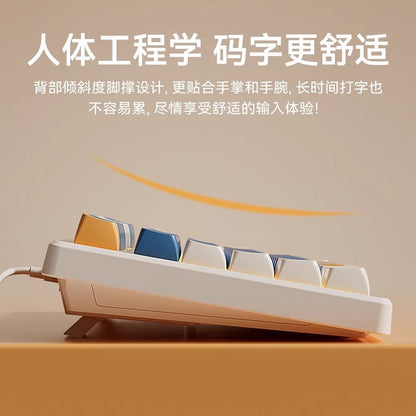 Keystrike – Side view of the keyboard's tilted back and fold-out stand, with a curved orange arrow above it