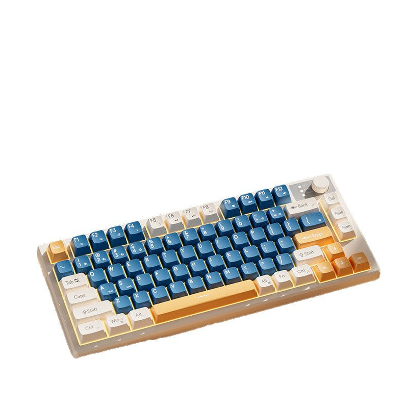 Keystrike – Angled studio view of the blue, white and orange compact keyboard with a knob on a white background
