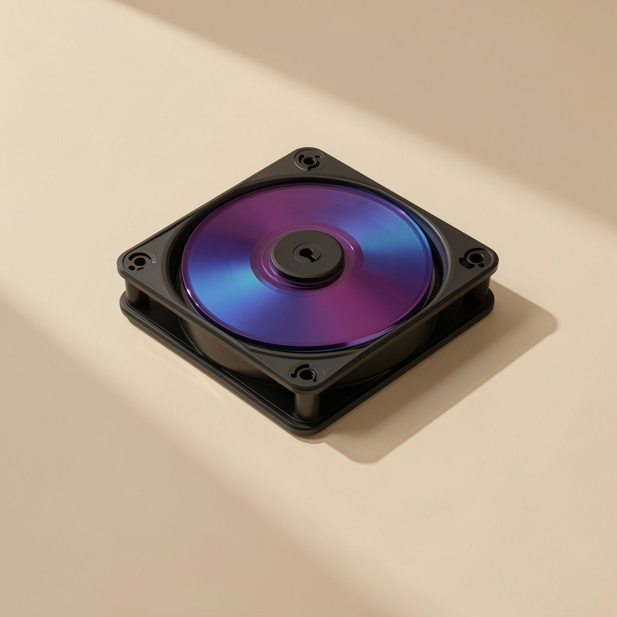 Airspin – Black square fan frame lying flat with a blue and purple iridescent center, on a beige surface
