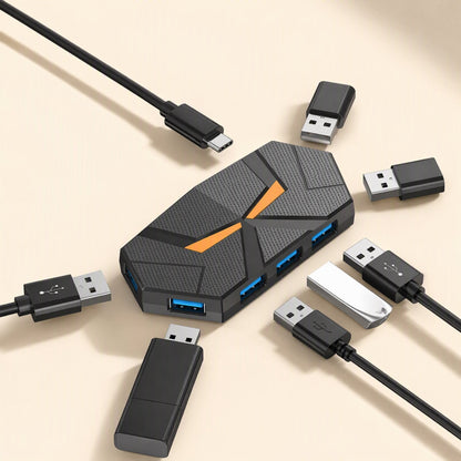 Glowbranch – Top view of the hub with orange light, surrounded by USB-C and USB-A cables, flash drives and a USB stick