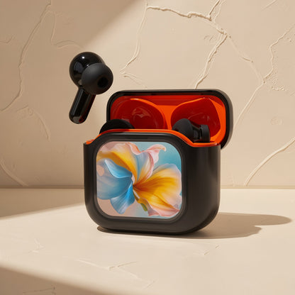 Quietwave – Open black case with orange interior and floral front panel, one earbud floating above, on a beige surface