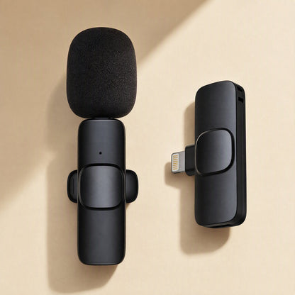 Freevoice – Single black lavalier mic with foam windscreen beside a Lightning receiver on a cream background