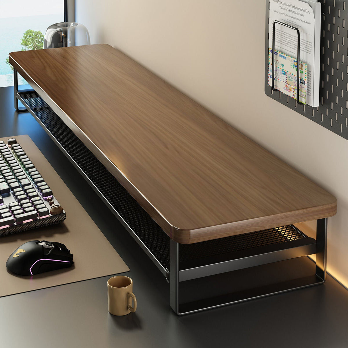 Oakdrawer – Walnut wood-grain monitor riser with black mesh shelf and black frame, beside a keyboard, mouse and mug