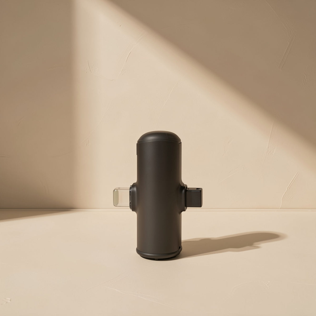 Voicepin Lavalier Microphone – black cylindrical receiver with Lightning and USB-C connectors, side view in angled light