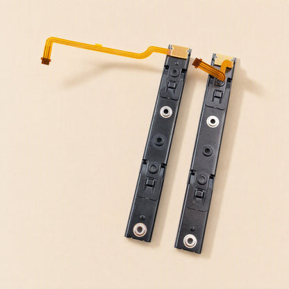Railglide – Left and right slide rails standing upright, showing metal screw points and ribbon cables at the top