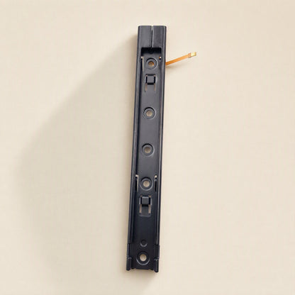 Railglide – Single slide rail seen from the bottom end with a short orange flex cable tip peeking out at the top