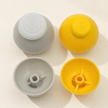 Rockergrip Plastic Rocker Cap in gray and yellow, shown top-down with domed tops and hollow undersides