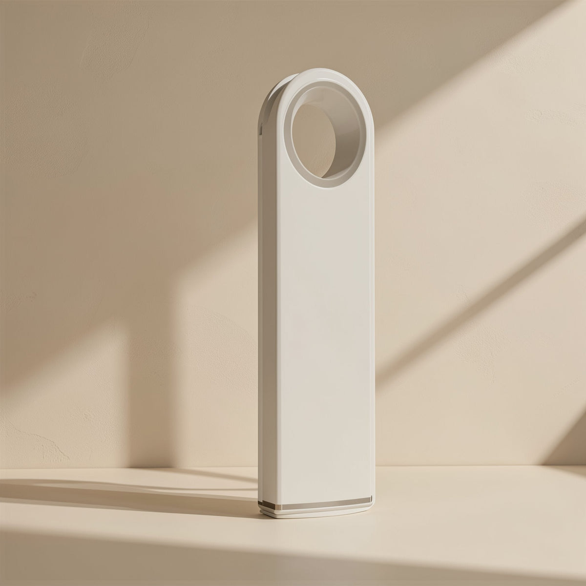 Metalbyte Metal USB Flash Drive in white standing upright with a round keyring hole against a sunlit wall