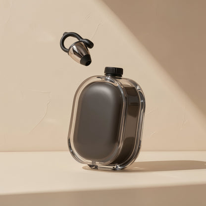 Cliphear clip-on Bluetooth earphone floating above its clear charging case with a black screw cap