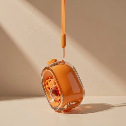 Cliphear – Orange case with an earphone inside hanging from an orange lanyard, tilted against a beige wall
