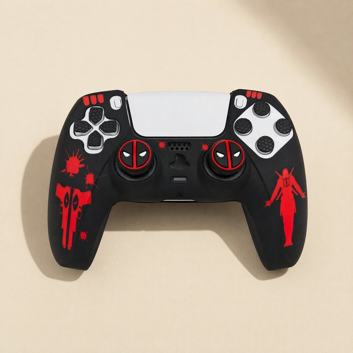 Spookshield – Black PS5 controller cover with red splatter, gun and figure artwork and red-white round thumbstick caps